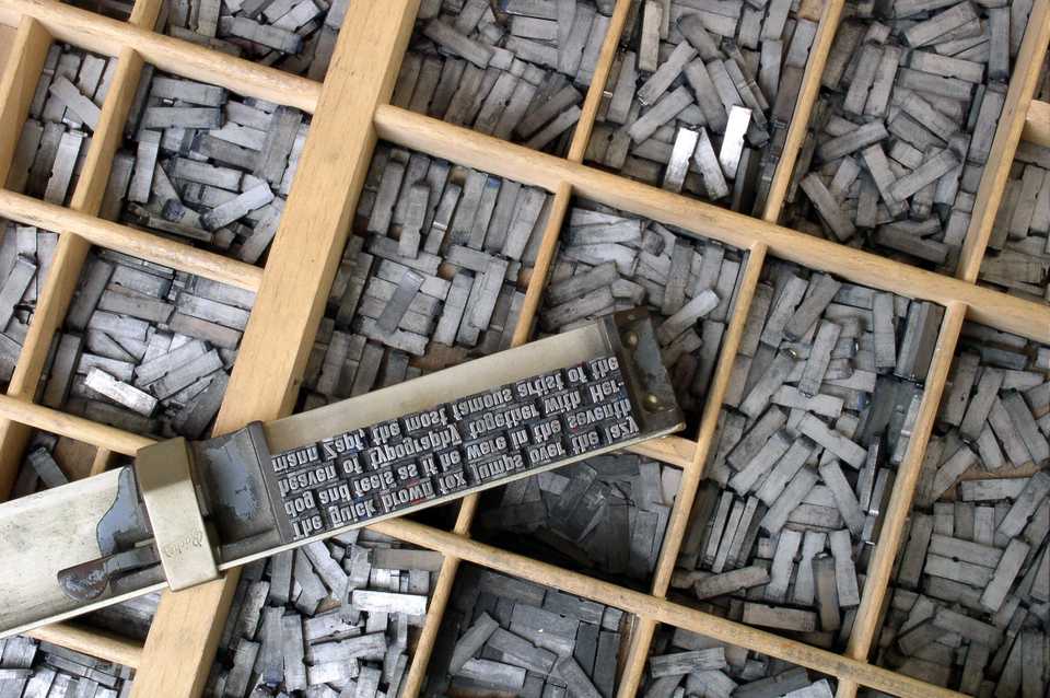Movable metal type, and composing stick, descended from Gutenberg's press. Photo by Willi Heidelbach. Licensed under CC BY 2.5